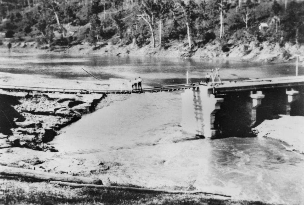 Flood damage to the weir at Mount Crosby, Queensland.  'John Oxley Library, State Library of Queensland negative: 161454 '.