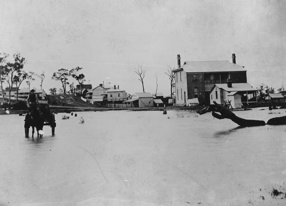 Floodwaters at the back of Sandgate Post Office in 1887 .'John Oxley Library, State Library of Queensland Image: 36250'.
