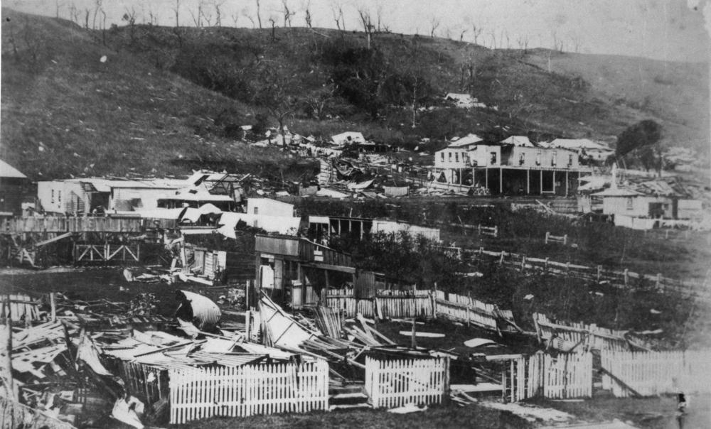 Storm damaged buildings at Port Douglas following the 1911 cyclone. 'John Oxley Library, State Library of Queensland Image: 127089'.