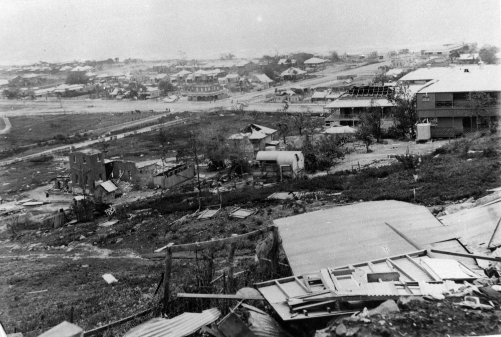 Storm damaged buildings in Townsville following Cyclone 'Leonta'. 'John Oxley Library, State Library of Queensland Image: 166426'.