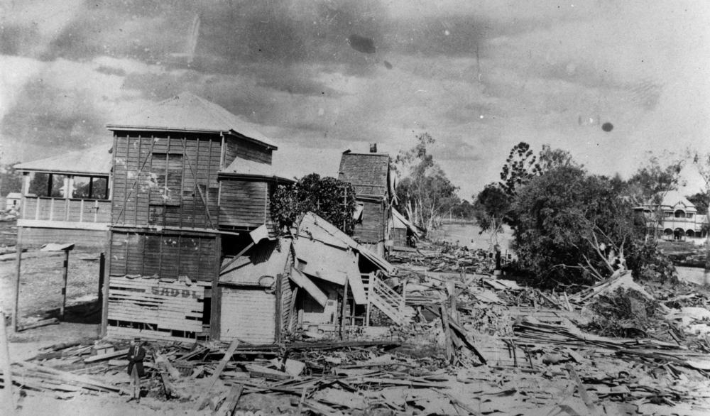 Flood damaged houses at Clermont.  'John Oxley Library, State Library of Queensland Image: 10483'