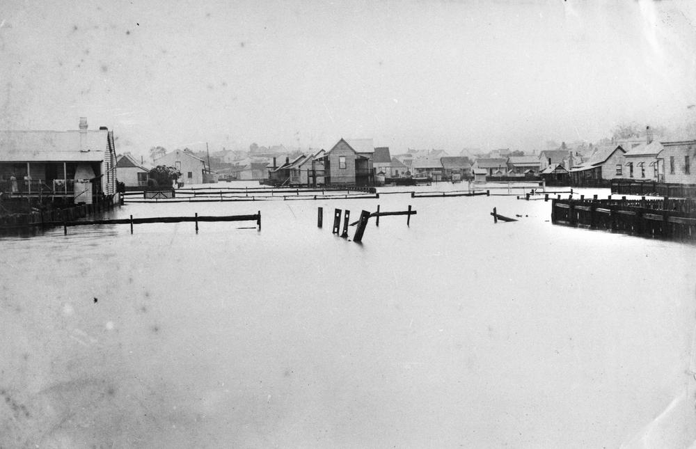 Floodwaters around James Street, Fortitude Valley, January 22, 1887. It shows a number of warehouse-type buildings inundated with the floodwaters.  'John Oxley Library, State Library of Queensland Image: 55977'.