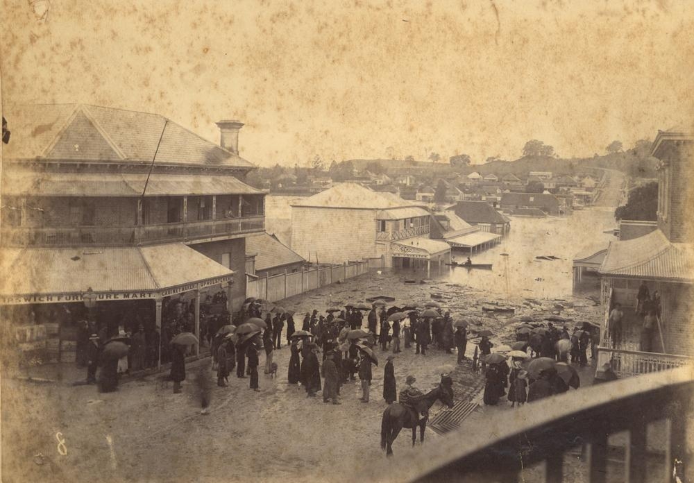 Floodwaters rise in the heart of Ipswich January 1887. 'John Oxley Library, State Library of Queensland Image: APO-017-01-0016'.