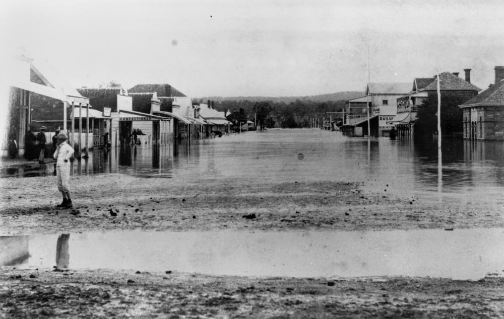 The second highest flood in the entire history of Warwick reached its peak at 3.30am on 22 January, 1887, causing much damage and loss of life. 'From the junction of the Albion and Fitzroy Streets and thence eastward to the old hospital the whole country was nothing but one mass of turbulent water, threatening destruction in every roar which in itself was unpleasant to hear...' ( Information from: the Warwick Examiner, 26 January 1887) .  'John Oxley Library, State Library of Queensland Image: 64370'.