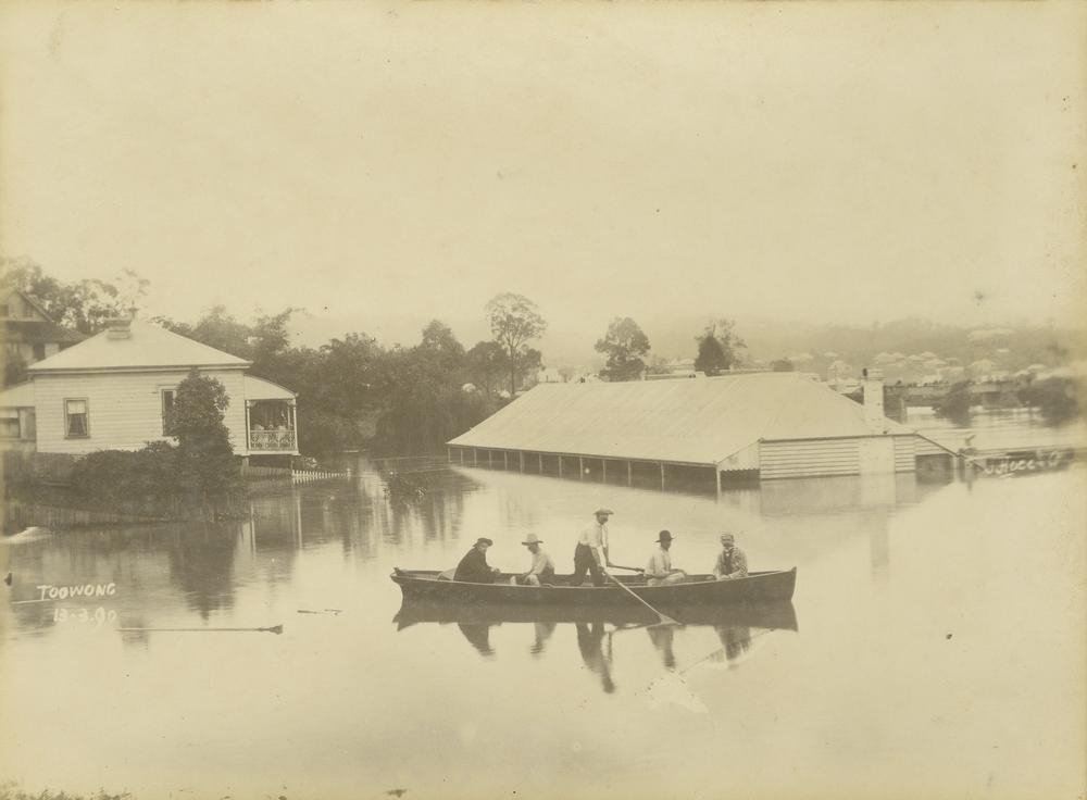 Rescue boat in floodwaters at Toowong. 'John Oxley Library, State Library of Queensland   Image: 7866-0001-0030'.
